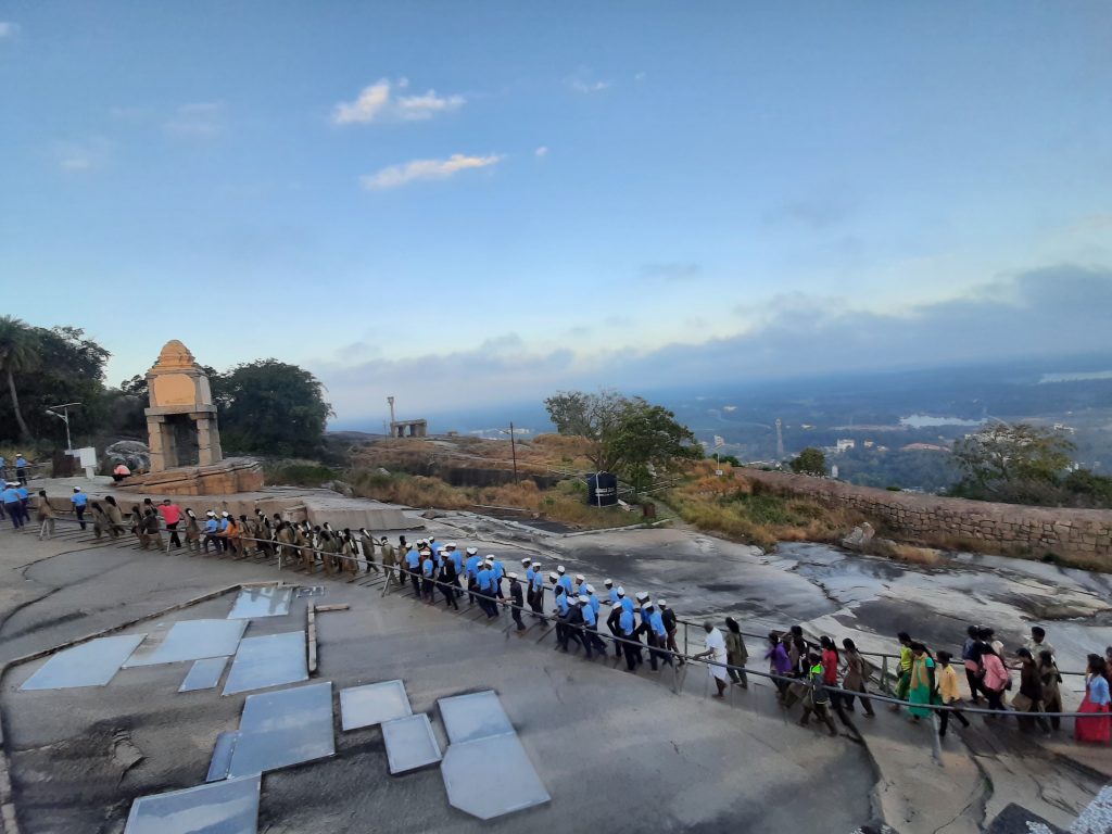 School children on excursion being escorted by teachers.