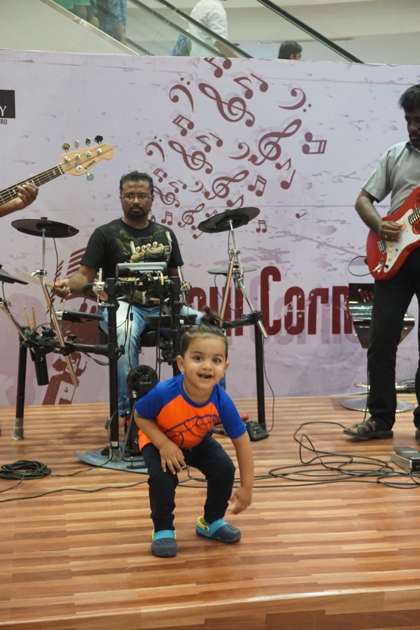 This kid danced for quite a long time. The musicians were enjoying his enthusiasm.